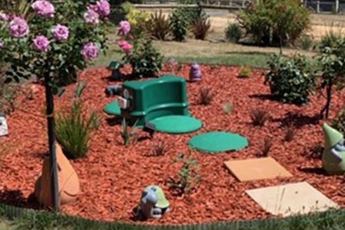 A Fuji wastewater system setup in a garden